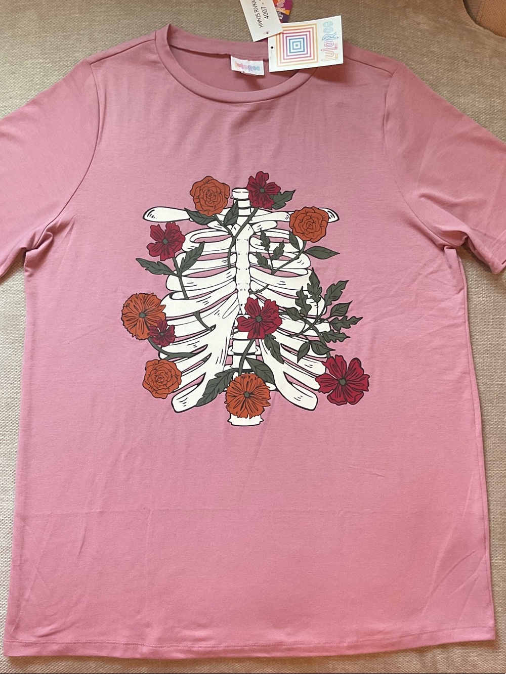 Women’s Pink Short Sleeve Tee with Ribcage and Floral Graphic
